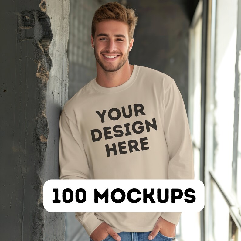 May include: A beige long-sleeve sweatshirt with the text "YOUR DESIGN HERE" printed on the front.
