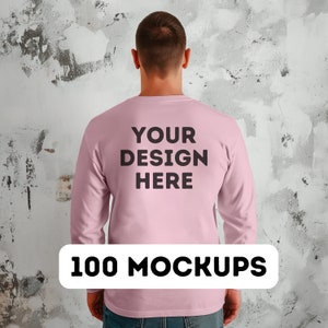May include: A pink long-sleeved shirt with the text "YOUR DESIGN HERE" printed on the back.