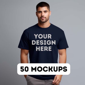 May include: A navy blue t-shirt with the text "YOUR DESIGN HERE" printed in white on the front. 50 MOCKUPS.