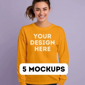 May include: A yellow long-sleeved sweatshirt with the text "YOUR DESIGN HERE" printed on the front. 5 MOCKUPS.