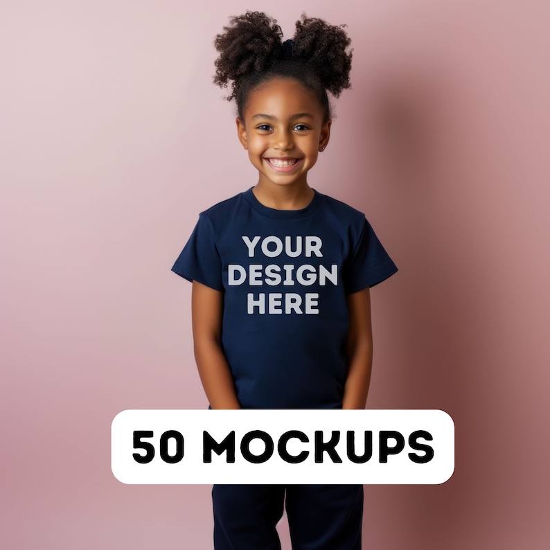 May include: A young person wearing a navy blue t-shirt with the text "YOUR DESIGN HERE" in white. A white banner at the bottom of the image reads "50 MOCKUPS". The background is a solid pink color.