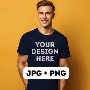 以下が含まれることがあります： 白い文字で「YOUR DESIGN HERE」とプリントされたネイビーのTシャツを着た男性。 JPG + PNG.