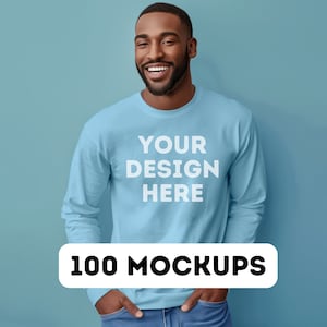 May include: A light blue long-sleeved sweatshirt with the text "YOUR DESIGN HERE" printed on the front. The sweatshirt is being worn by a person with a light blue background.