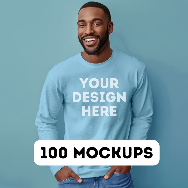 May include: A light blue long-sleeved sweatshirt with the text "YOUR DESIGN HERE" printed on the front. The sweatshirt is being worn by a person with a light blue background.