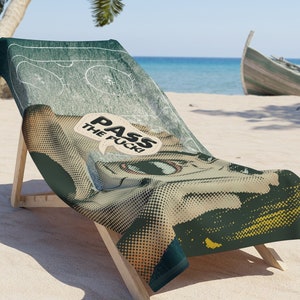 May include: A green and yellow beach towel with a comic book style illustration of a hockey player. The towel has the text "PASS THE PUCK!" in a speech bubble.