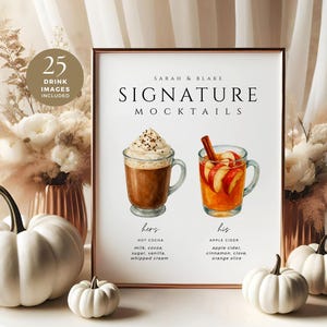 May include: A framed print with the text "Signature Mocktails" and two drink illustrations. The print is surrounded by white pumpkins and floral arrangements. The text includes drink ingredients.