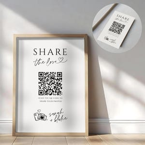 May include: A framed print with the words "SHARE the love" and a QR code. Below the QR code is the text "SCAN THE QR CODE TO SHARE YOUR PHOTOS" and the names "Sarah + Blake". A smaller card with the same design is also visible.