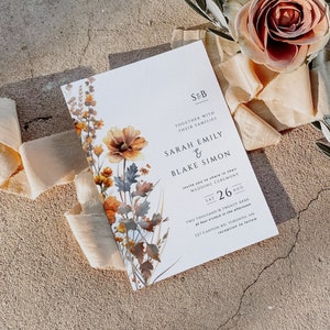 May include: A wedding invitation featuring a floral design in shades of brown, orange, and white. The invitation reads "S&B Together with their families Sarah Emily & Blake Simon invite you to share in their wedding ceremony Sat 26 Aug Two thousand & twenty xxxx at four o'clock in the afternoon 127 Canton Rd, Toronto, ON reception to follow"