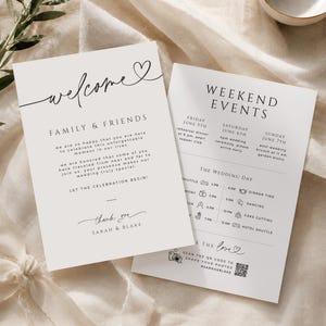 Op de afbeelding: Twee witte trouwkaarten met zwarte tekst. De eerste kaart bevat de tekst Welcome, Family & Friends en Sarah & Blake. De tweede kaart toont Weekend Events, met een planning voor vrijdag, zaterdag en zondag en een QR-code voor foto's.