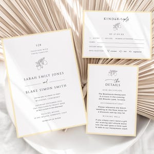 May include: A wedding invitation suite featuring a lemon illustration. The invitation card displays the names Sarah Emily Jones and Blake Simon Smith, the wedding date, and the venue. The RSVP card allows guests to accept or decline the invitation, provide their names, dietary requirements, and meal choice. The details card provides information about the reception, accommodation, and wishing well.