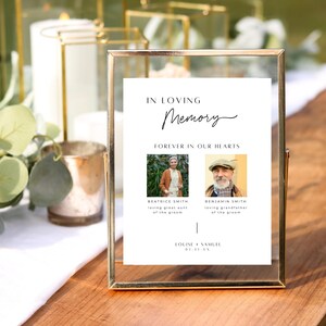 May include: A white framed sign with the text "In Loving Memory" and "Forever in Our Hearts". Two black and white photos of older adults are displayed with the text "Beatrice Smith, loving great aunt of the groom" and "Benjamin Smith, loving grandfather of the groom". The sign also includes the text "Louise & Samuel 01.11.XX".