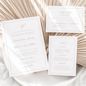 Peut inclure: Ensemble de faire-part de mariage blancs avec texte et bordures gris. L'ensemble comprend une invitation, une carte de réponse et une carte de détails. L'invitation présente les noms des mariés et les détails de l'événement.