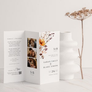 May include: A wedding invitation featuring a floral design in shades of orange, brown, and purple. The invitation includes the names Sarah Emily and Blake Simon, the date Saturday, 26th August, and the location Toronto, Ontario. A QR code is also included for sharing photos.