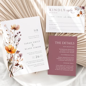 Op de afbeelding: Een huwelijksuitnodigingsset met een bloemenontwerp. De uitnodiging bevat een aquarelillustratie van wilde bloemen in tinten oranje, bruin en paars. De tekst luidt "S&B" en "Sarah Emily & Blake Simon". De detailkaart bevat informatie over de receptie, accommodatie en een wensfontein.