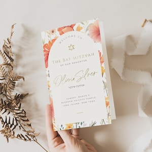 Puede incluir: Una invitación floral de Bat Mitzvah con una estrella de David dorada y el texto "Bienvenido a la Bat Mitzvah de nuestra hija Olivia Silver אוליבה סילבר Domingo, 5 de marzo Blossom Heights Temple Long Island, Nueva York"
