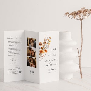 May include: A wedding invitation featuring a floral design and photographs of the couple. The invitation reads "Welcome to the wedding of Sarah Emily & Blake Simon, Sat 26 Aug, Toronto, Ontario".