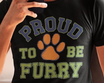 May include: A black t-shirt with a green and blue graphic that says "Proud to be Furry" with a paw print in the middle.