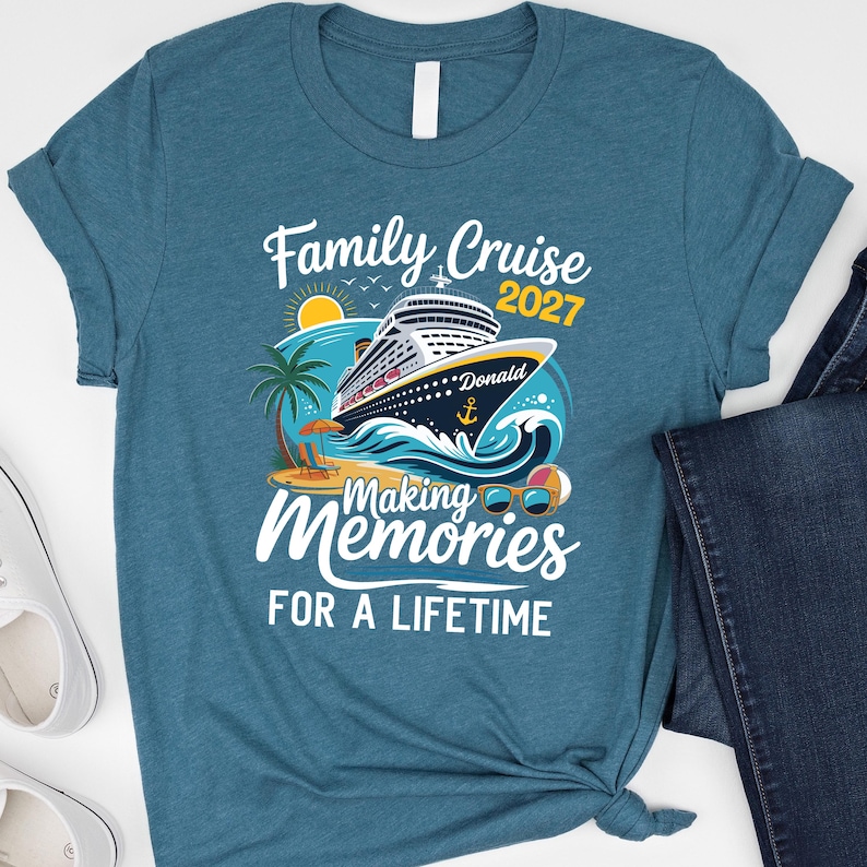 May include: A teal blue short-sleeve t-shirt featuring a graphic of a cruise ship on ocean waves, a palm tree, a beach chair, and sunglasses. The text reads Family Cruise 2027, Donald, Making Memories, and FOR A LIFETIME in white and yellow.