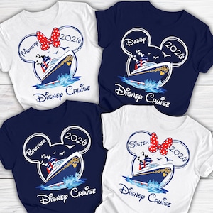 May include: Four t-shirts with a Disney Cruise theme. Each shirt features a Mickey Mouse head outline with text indicating "Mommy", "Daddy", "Brother", and "Sister". The shirts also display a cruise ship graphic and the year "2026".