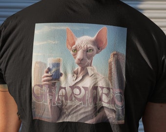 May include: Black t-shirt featuring a graphic print of a Sphynx cat holding a glass of beer. The cat is wearing a white shirt and the text "CHARMED" is printed below the cat.