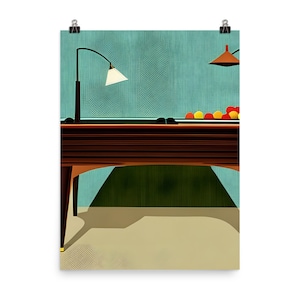 May include: A brown wooden snooker table with a green felt surface. The table is set up in a room with a teal blue wall and two lamps. There are red and yellow balls on the table.