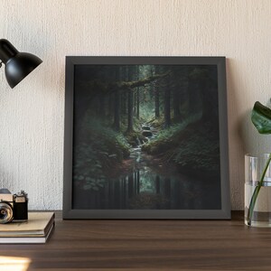 May include: A framed photograph of a forest scene with a small stream running through it. The stream is surrounded by lush green foliage and the trees are tall and dark.