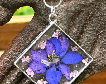 Handmade pressed flower pendant.