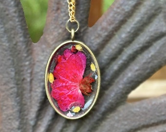 Pressed rose flower pendant.