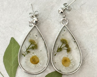 Handmade pressed flower resin earrings.