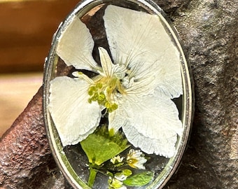Handmade pressed flower pendant.