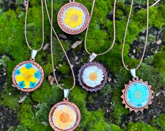 Pressed flowers  natural wood necklaces.