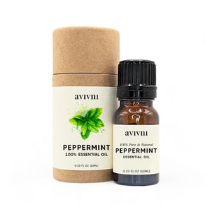 May include: A brown cardboard tube with a white label that says "avivni" and "PEPPERMINT 100% ESSENTIAL OIL 0.33 FL OZ (10ML)". The label also features a green illustration of a peppermint leaf. A small brown glass bottle with a black cap and a white label that says "avivni 100% Pure & Natural PEPPERMINT ESSENTIAL OIL 0.33 FL OZ (10ML)" is in front of the tube.