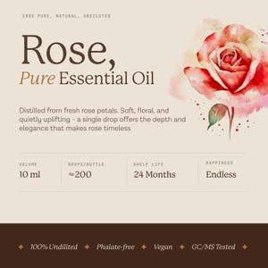 May include: A product label for Rose, Pure Essential Oil. The label features a watercolor illustration of a red rose. Text includes "100% Pure, Natural, Undiluted", "Distilled from fresh rose petals", and volume of 10 ml.