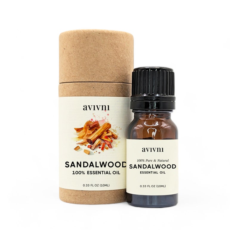 May include: A brown cardboard tube with a white label that says "avivnı Sandalwood 100% Essential Oil 0.33 FL OZ (10ML)" and a watercolor illustration of sandalwood. A small amber glass bottle with a black cap and a white label that says "avivnı 100% Pure & Natural Sandalwood Essential Oil 0.33 FL OZ (10ML)".