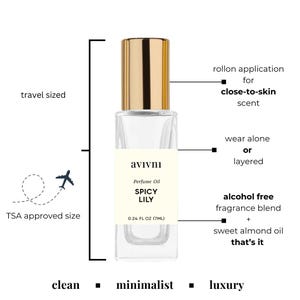 May include: A small perfume oil bottle with a gold cap and a clear glass body. The label says "SPICY LILY" and "0.24 FL OZ (7ML)". It has a roll-on applicator and is alcohol-free. The design is clean, minimalist, and luxurious, and travel-sized.
