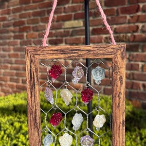 Rose bead chicken wire sun catcher in wood frame