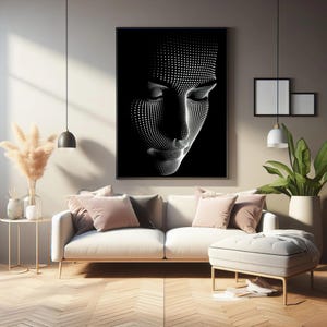 May include: Framed black and white artwork depicting a face formed from white dots. The art hangs above a white sofa with pink cushions. The room has a modern design, with wooden flooring and a neutral colour palette.