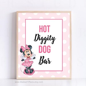 May include: Pink and white polka dot sign with a cartoon image of Minnie Mouse. The sign reads "Hot Diggity Dog Bar".