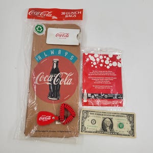 Vintage Coca-Cola Collectable Lot | Coca-Cola Paper Bags | Coke Rain Poncho | Coca-Cola Key Ring | Coca-Cola Pin