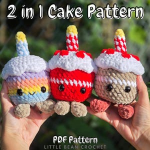 May include: Three crocheted cupcake toys with smiling faces and candle toppers. One is rainbow-coloured, one is red, and one is tan. The text "2 in 1 Cake Pattern" and "PDF Pattern" are visible.