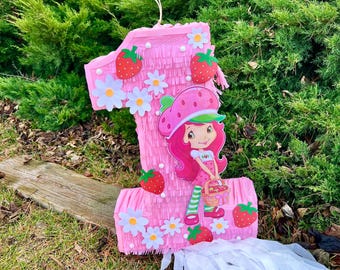 Piñata de fresas con números para fiesta de cumpleaños (Números disponibles del 1 al 9). Elige entre la opción tradicional o con cuerdas para tirar.