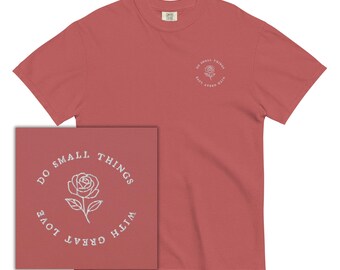 May include: A red t-shirt with a white graphic that says "Do small things with great love" and a rose illustration.