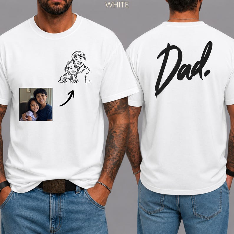 May include: A white t-shirt featuring a black line art illustration of two people on the front chest, accompanied by a small square photograph of the same two people and a black arrow. The back of the shirt displays the word Dad in black script.