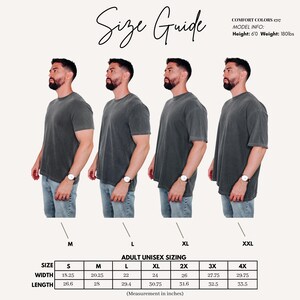 May include: Size guide graphic showing a model in a grey t-shirt across various sizes, from M to XXL. The guide provides measurements in inches for adult unisex sizing, detailing width and length for each size. The text "Size Guide" is at the top.