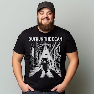 Funny Raccoon UFO T-Shirt: Outrun the Beam Cotton Tee