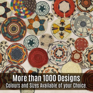 May include: A collection of round, woven wall baskets featuring diverse geometric patterns in red, orange, yellow, blue, black, and natural tan. The image includes the text: More than 1000 Designs Colours and Sizes Available of your Choice.