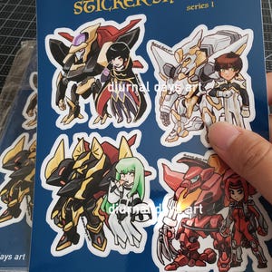 May include: A set of four stickers featuring anime-style characters and robots. The stickers are printed on white paper with a blue background. The text "REBELLION STICKER SHEET series 1" is printed at the top of the sheet. The text "diurnal days art" is printed at the bottom of the sheet.