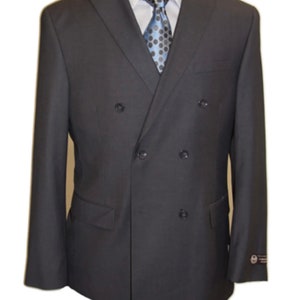 May include: A dark gray double-breasted suit jacket with a notched lapel. The jacket has six buttons down the front and two flap pockets on the sides.