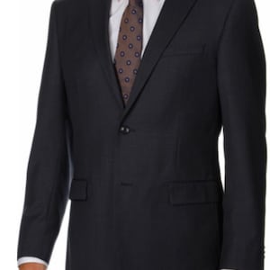 May include: A dark blue suit jacket with a single button closure and a brown patterned tie.