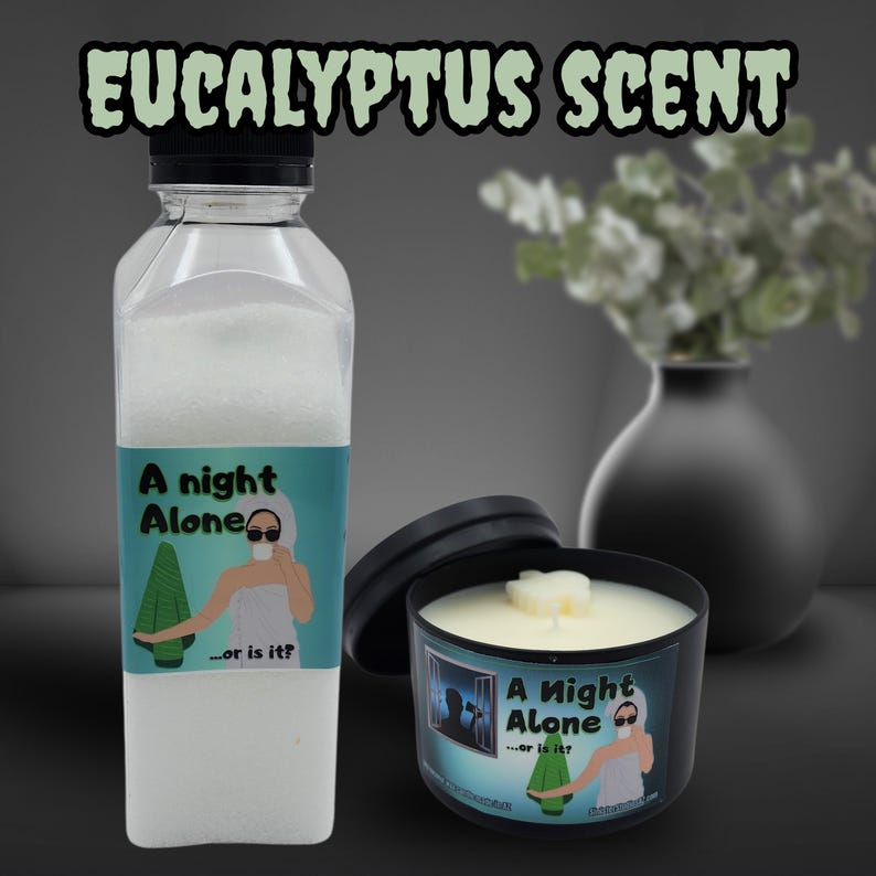 May include: A clear bottle filled with white granules and a black-lidded candle, both labeled "A Night Alone...or is it?" The candle sits next to a black vase with greenery. The text "EUCALYPTUS SCENT" is at the top.
